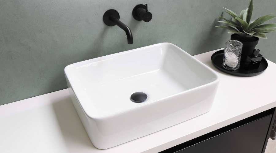 A white colored wash basin sink in bathroom.